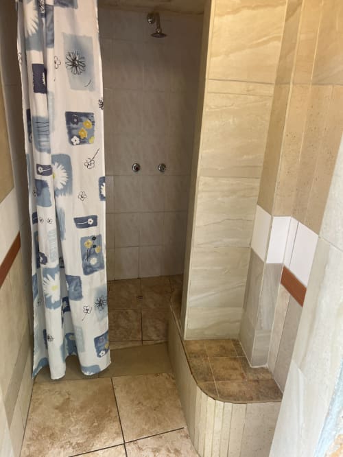 Outdoor shower for campers includes hot water