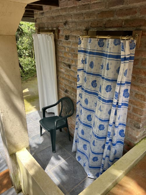 Outdoor shower for camping guests at Mindo Lindo