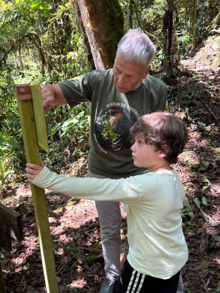 Heike Brieschke with a child on a trail at Mindo Lindo.