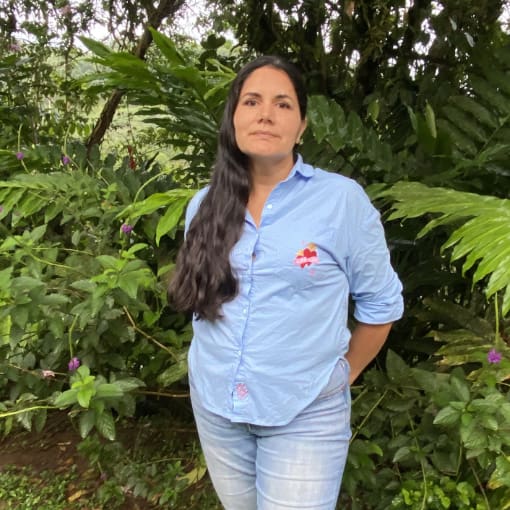 María José Guerrero, FEVE treasurer, stands in the gardens at Mindo Lindo