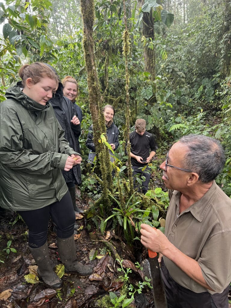 Outdoor education on the trail as Pedro talks to a small group of students.