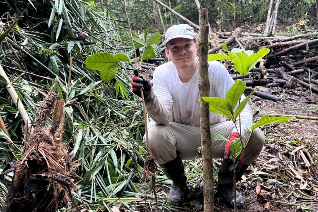 A volunteer planting trees at the Mindo Lindo Reserve